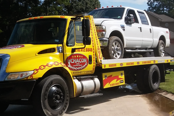 Chacon Towing Flatbed Tow Truck Towing a truck